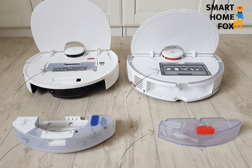 Staubbehälter und Wasserbehälter eines Saug-Wisch-Roboters stehen nebeneinander auf dem Boden